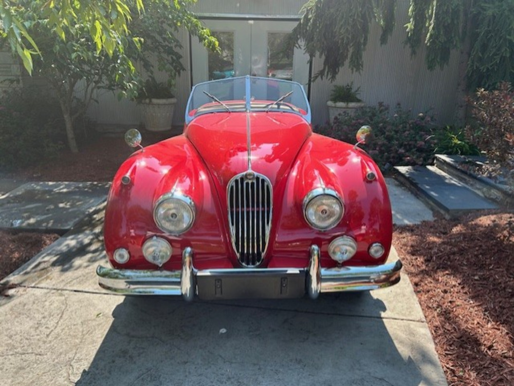 1956 Jaguar XK 140 Roadster head-on view highlighting cabin and windscreen